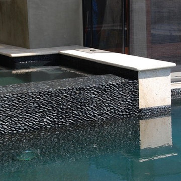 Gray Black Standing Pebble Tile Pool Wall