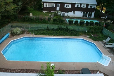 This is an example of a swimming pool in Boston with concrete slabs.
