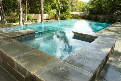 Pool - mid-sized traditional concrete paver and custom-shaped natural pool idea in Dallas
