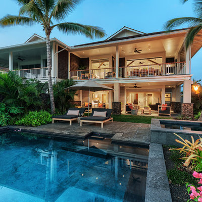 Inspiration for a tropical backyard tile and rectangular hot tub remodel in Hawaii
