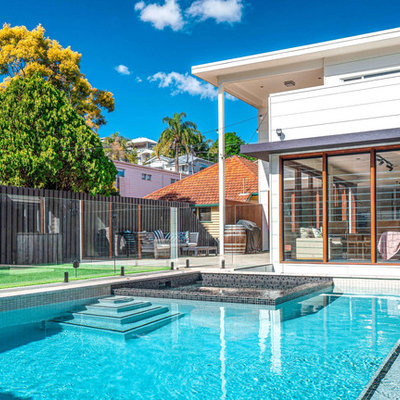 Hot tub - mid-sized modern backyard tile and rectangular aboveground hot tub idea in Brisbane