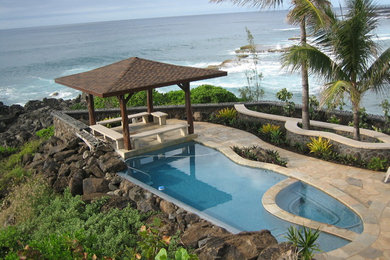 Island style custom-shaped pool photo in Hawaii