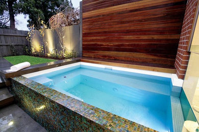 Inspiration for a small modern back rectangular above ground swimming pool in Melbourne.
