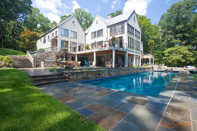 Large elegant backyard rectangular and tile lap pool photo in Baltimore
