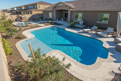 Large trendy pool photo in Phoenix