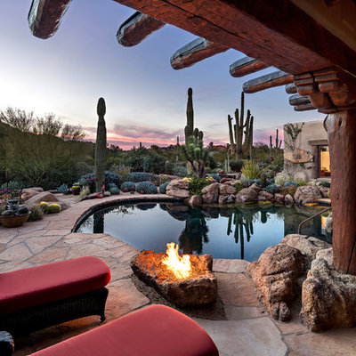 Example of a southwest backyard custom-shaped lap pool design in Phoenix