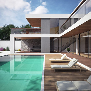 Ispirazione per una piscina minimal rettangolare dietro casa con pedane