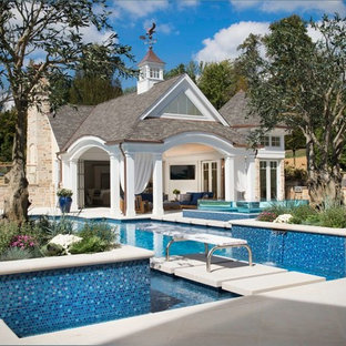 Inspiration for a huge timeless backyard rectangular and stamped concrete lap pool house remodel in Cleveland
