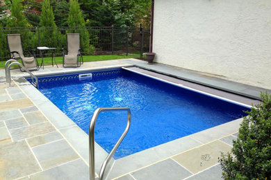 Design ideas for a medium sized back swimming pool in New York.