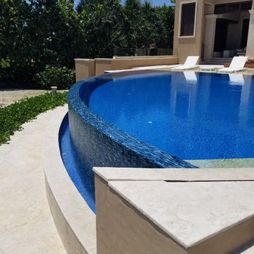 Infinity Edge Custom Shaped Pool with Sun Shelf in Stuart, Florida
