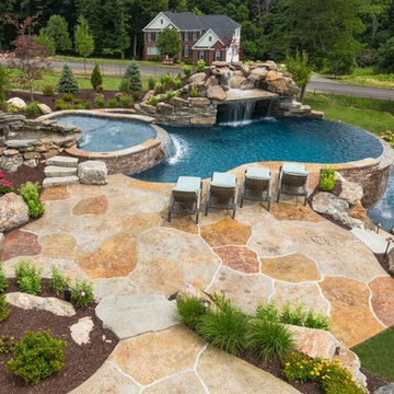 Infinity Edge Pool with Sun Ledge, Grotto, Waterfall & Floating Steps
