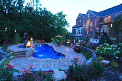 Custom-shaped pool photo in St Louis