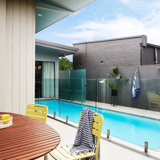 Photo of a contemporary backyard rectangular lap pool in Sydney.