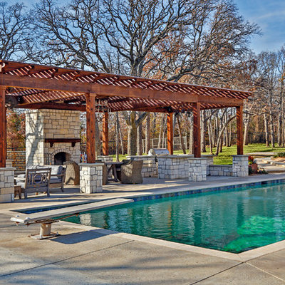 Mid-sized trendy backyard rectangular and concrete pool photo in Dallas