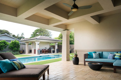 Mid-sized trendy backyard stone and rectangular lap pool photo in Hawaii