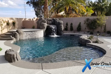 Island style pool photo in Las Vegas