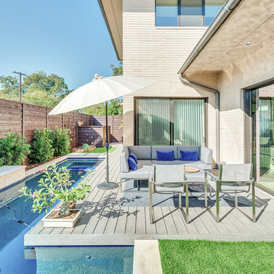 Inspiration for a contemporary backyard rectangular lap pool fountain remodel in Dallas