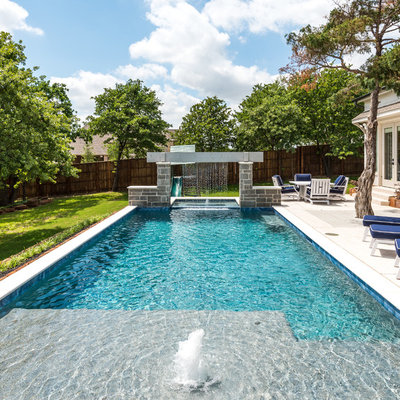 Inspiration for a contemporary backyard concrete and rectangular lap pool fountain remodel in Dallas