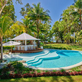 Inspiration for a tropical custom-shaped pool in Cairns with with a pool.