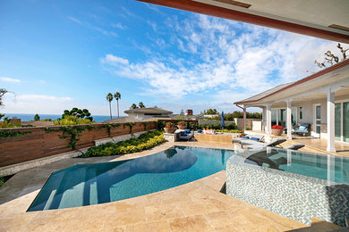 Inspiration for a coastal pool remodel in Orange County
