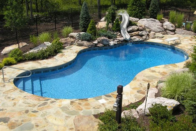 This is an example of a bohemian swimming pool in Other.