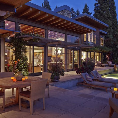 Hot tub - large contemporary backyard concrete paver and rectangular lap hot tub idea in Seattle