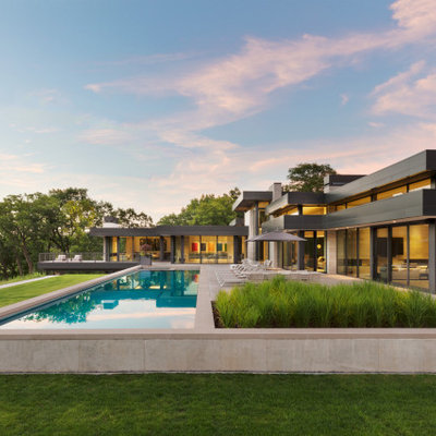Inspiration for a contemporary custom-shaped lap pool remodel in Minneapolis