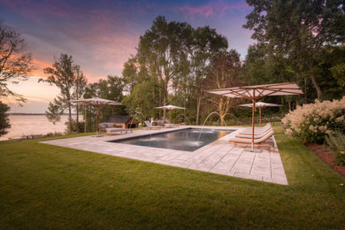 Pool fountain - large transitional backyard stone and rectangular lap pool fountain idea in Toronto