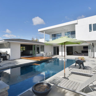 Pool - mid-sized modern backyard concrete and rectangular pool idea in Los Angeles