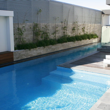 Lap Pool Design with the clever use of glass panel windows