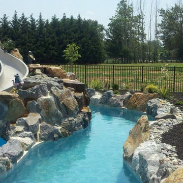 Large Pool with boulder waterfall ,water slide and a lazy river