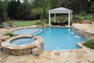 Backyard custom-shaped pool photo in Atlanta
