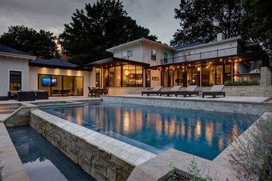 Example of a trendy custom-shaped pool design in Kansas City