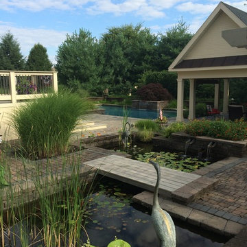 Lower Saucon custom pool with raised planters & sheer descent waterfall