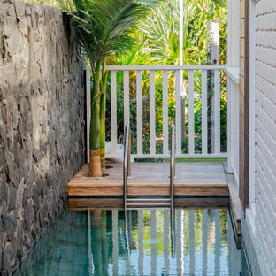 Inspiration for a tropical rectangular pool in Gold Coast - Tweed with decking.