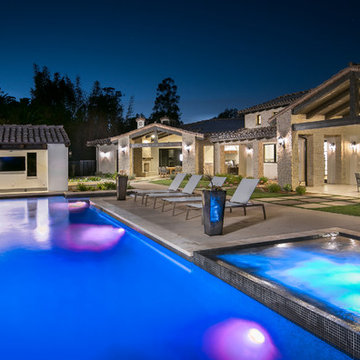 Luxurious pool with waterfall and hot tub