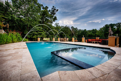 This is an example of a large mediterranean swimming pool in Atlanta.