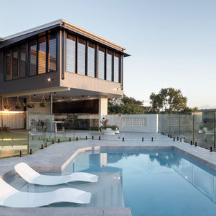 Design ideas for a large contemporary custom-shaped pool in Brisbane with tile.