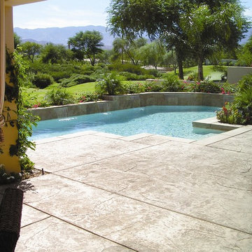 Luxury swimming pool with a stamped concrete pool deck.