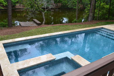 Hot tub - small contemporary backyard stone and rectangular lap hot tub idea in Atlanta