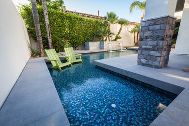 Minimalist backyard rectangular hot tub photo in Phoenix with decking