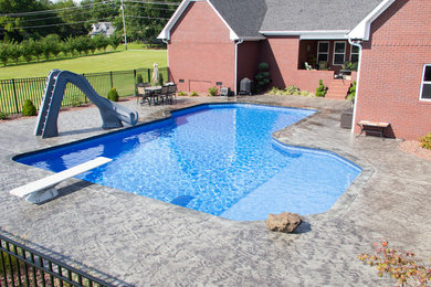 Inspiration for a large transitional backyard custom-shaped and concrete water slide remodel in Chicago