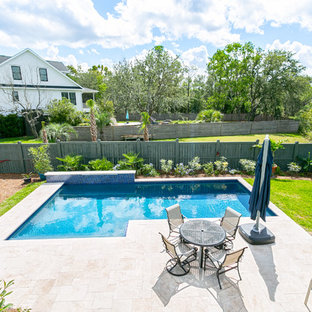 Inspiration for a mid-sized beach style backyard l-shaped natural pool in Charleston with a water feature and tile.