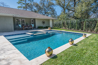 Pool - mid-sized mediterranean backyard stone and rectangular pool idea in Houston