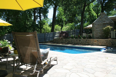 Inspiration for a large 1950s backyard stone and rectangular lap pool remodel in St Louis