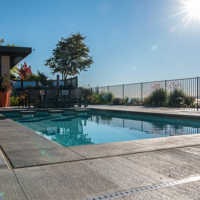 Mid-sized 1950s backyard rectangular pool photo in Seattle