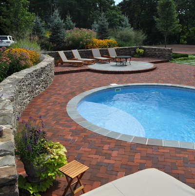 Traditional Pool by Milieu Landscaping