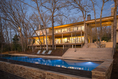 Inspiration for a large transitional backyard tile and rectangular lap pool remodel in Austin