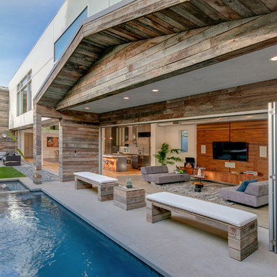 Pool fountain - mid-sized contemporary backyard concrete and rectangular pool fountain idea in Los Angeles