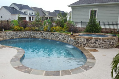 Hot tub - mid-sized transitional backyard tile and kidney-shaped natural hot tub idea in Atlanta